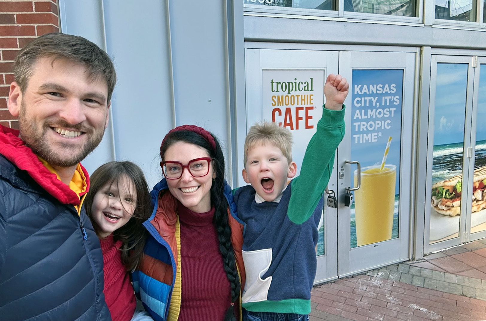 Paul, Monroe, Nikki, and William Vogel outside the future Tropical Smoothie Cafe location in the Power & Light District; photo by Joyce Smith