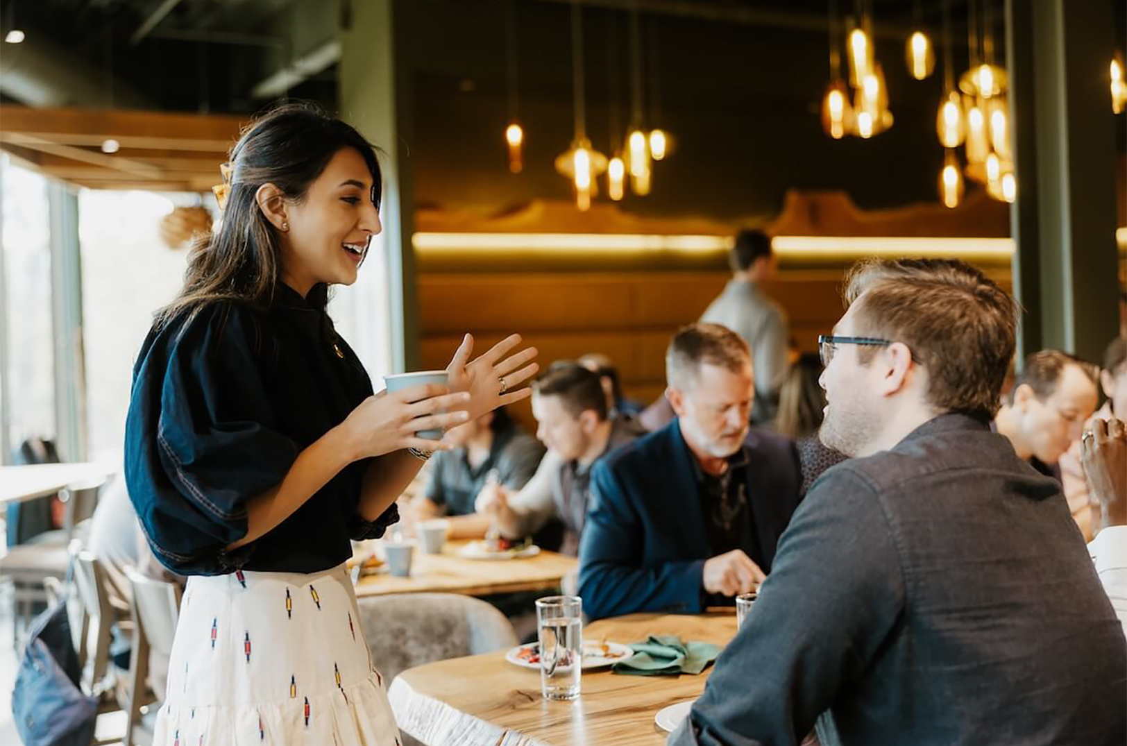 Serafina Lalany, StartupNWA, talks with entrepreneurs during a past VC Immersions event in Northwest Arkansas; photo courtesy of StartupNWA