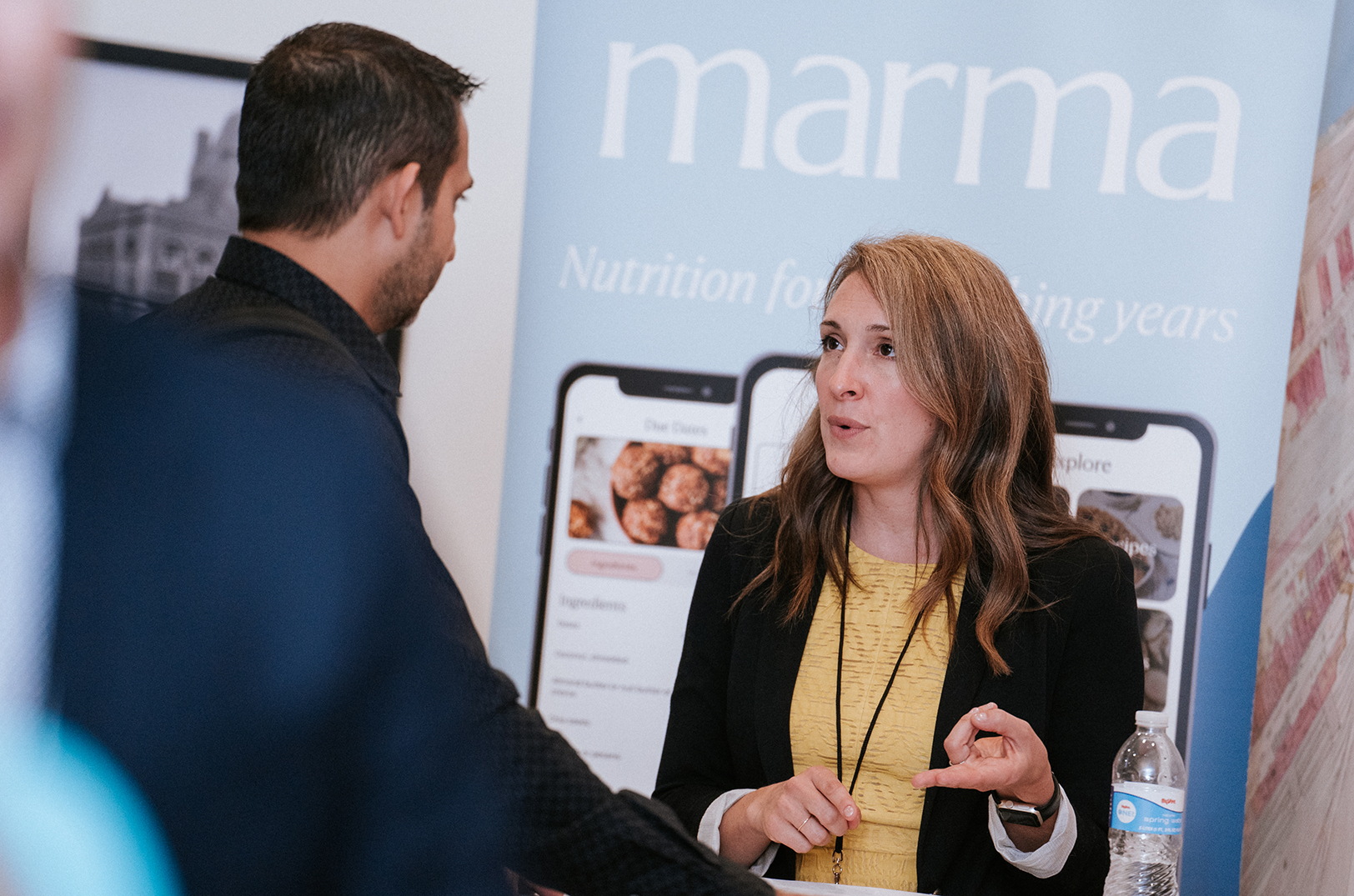 Meredith Evans McAllister, Marma, tells a fellow InvestMidwest attendee about her startup at the 2024 summit in Kansas City; photo courtesy of InvestMidwest