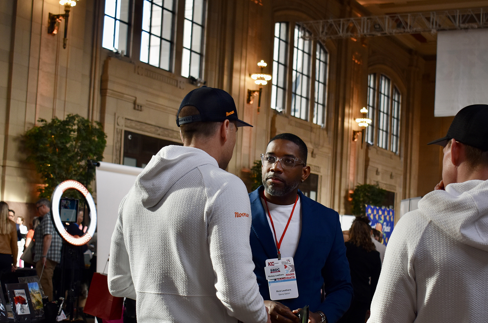 Rickey Leathers, Savvy Salon, center, chats with Alex Reed, Noonan and GolfTRK, during the KC Chamber's showcase for small businesses at Union Station; photo by Nikki Overfelt Chifalu, Startland News