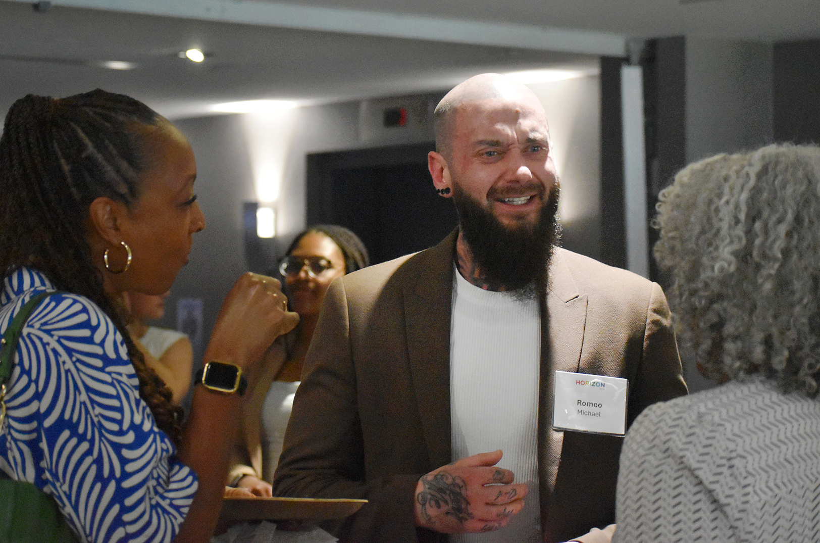Dr. Romeo Michael, the Excel Center’s inaugural director, speaks with fellow civic leaders during KC Rising's 2025 Horizon event; photo by Nikki Overfelt Chifalu, Startland News