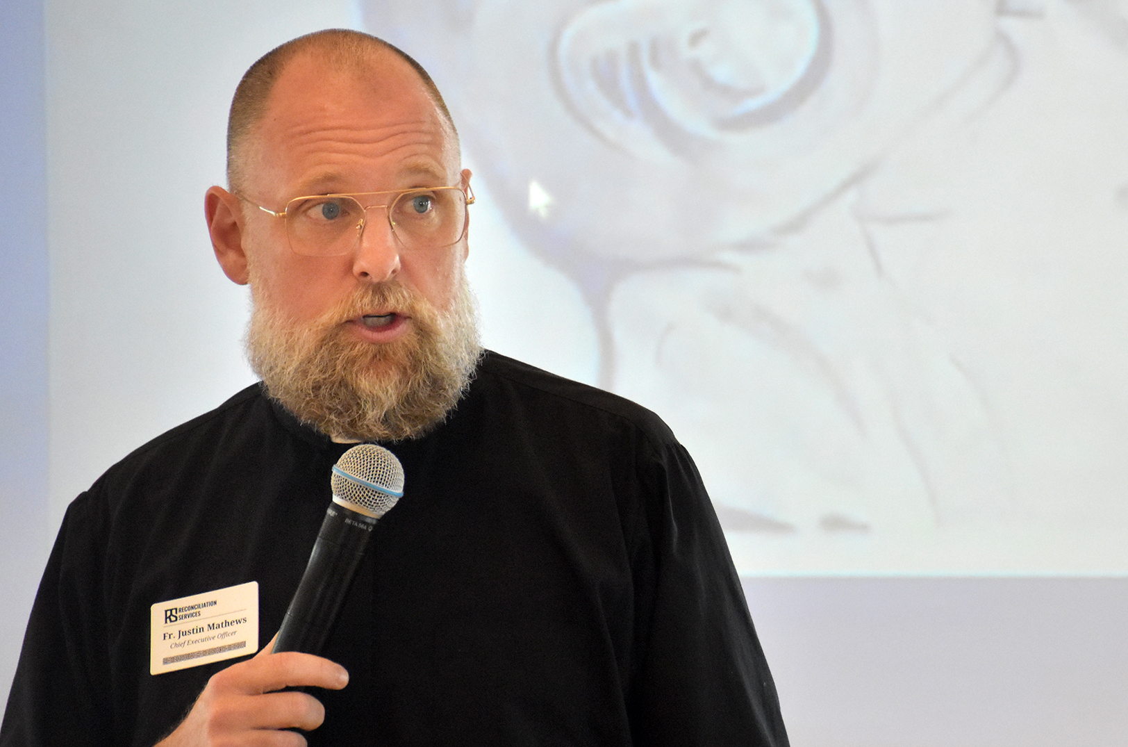 Father Justin Mathews, Reconciliation Services, speaks during a launch event for RS Impact Exchange; photo by Taylor Wilmore, Startland News