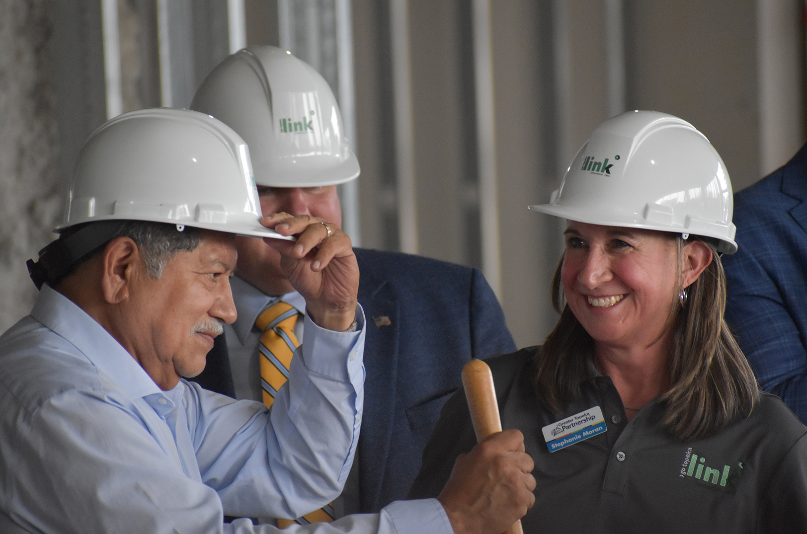 Michael Padilla, mayor of Topeka, and Stephanie Moran, senior vice president for innovation at Go Topeka and interim CEO of the Greater Topeka Partnership, celebrate the ceremonial groundbreaking for the Link Innovation Labs space in downtown Topeka; photo by Tommy Felts, Startland News