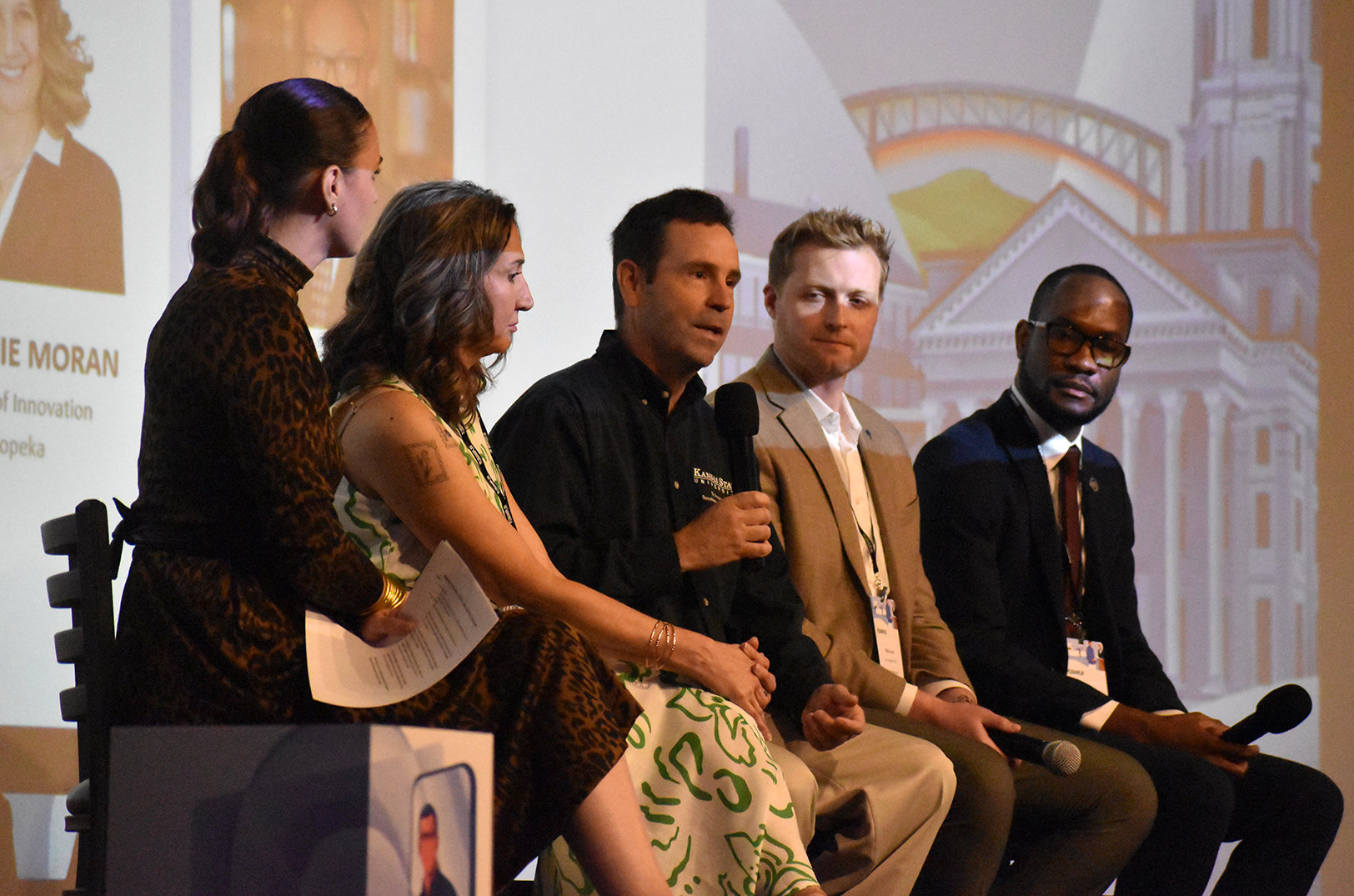 Bret Lanz, Kansas State University Technology Development Institute, center, speaks in June at the Plug and Play Animal Health & AgTech Expo in Topeka, alongside Lindsay Lebahn, Plug and Play Topeka; Stephanie Moran, Go Topeka; Nick Love, Love Lifesciences; and Romaine Redman, Kansas Department of Commerce; photo by Nikki Overfelt Chifalu, Startland News