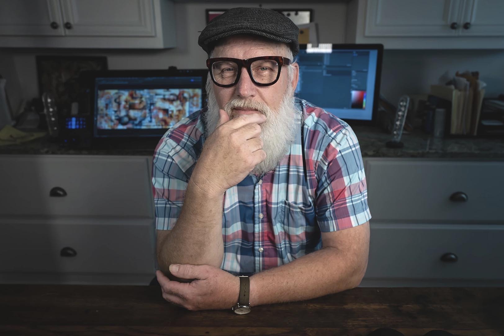 David Morris works in his home studio in Shawnee, Kansas. His latest abstract digital collage is called “Music is Community," and it’s part of this year’s Art in the Loop program; photo by Julie Denesha, KCUR