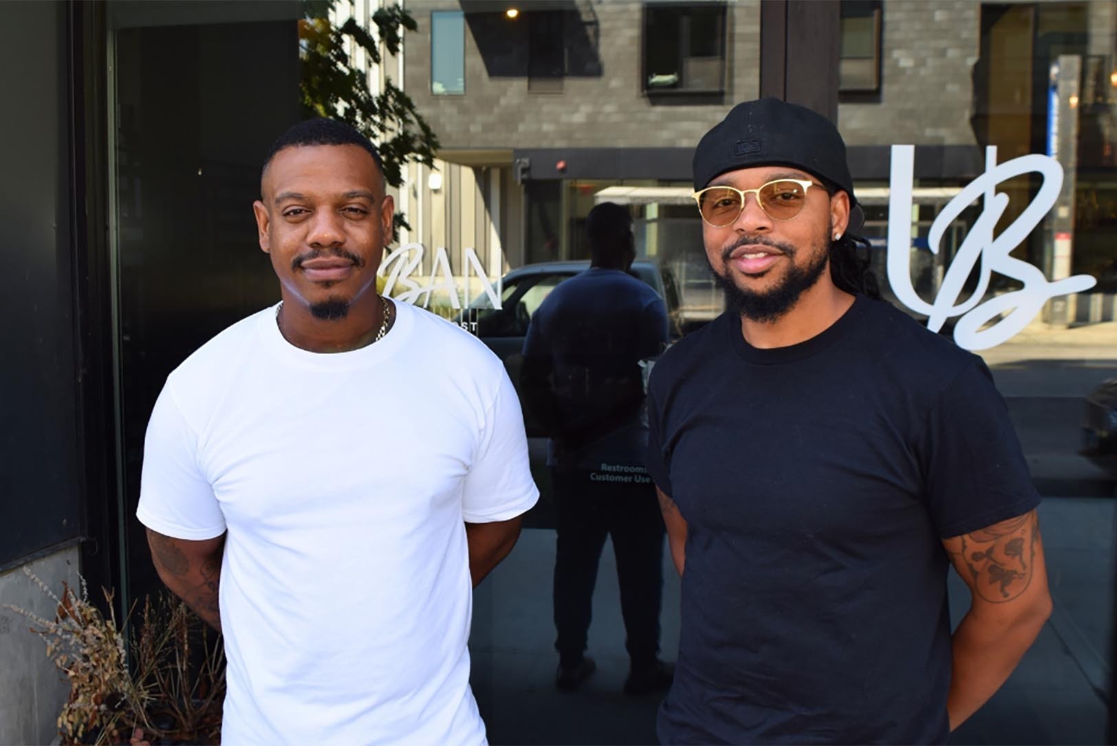 Urban Restaurant co-owners Justin Clark and Ron Evans stand in front of their year-old restaurant space at Armour Boulevard and Troost Avenue; photo by Thomas White, The Beacon