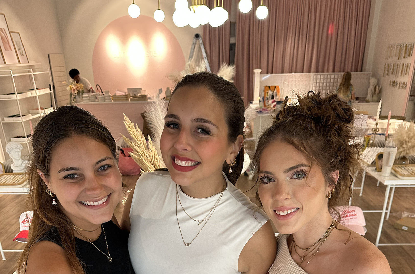 Annie Austen, center, poses with her sister, Lucie Callicotte, and general manager Jordyn Chadwick hours before the opening of the new Overland Park shop at at 7941 Santa Fe Drive; photo by Joyce Smith
