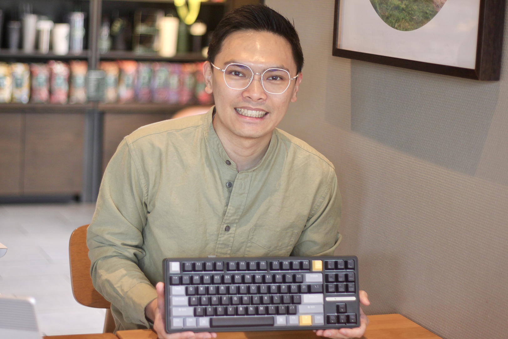 Jerry Hsu with his Phronesis AI mechanical keyboard by Virtusx; photo by Nikki Overfelt Chifalu, Startland News