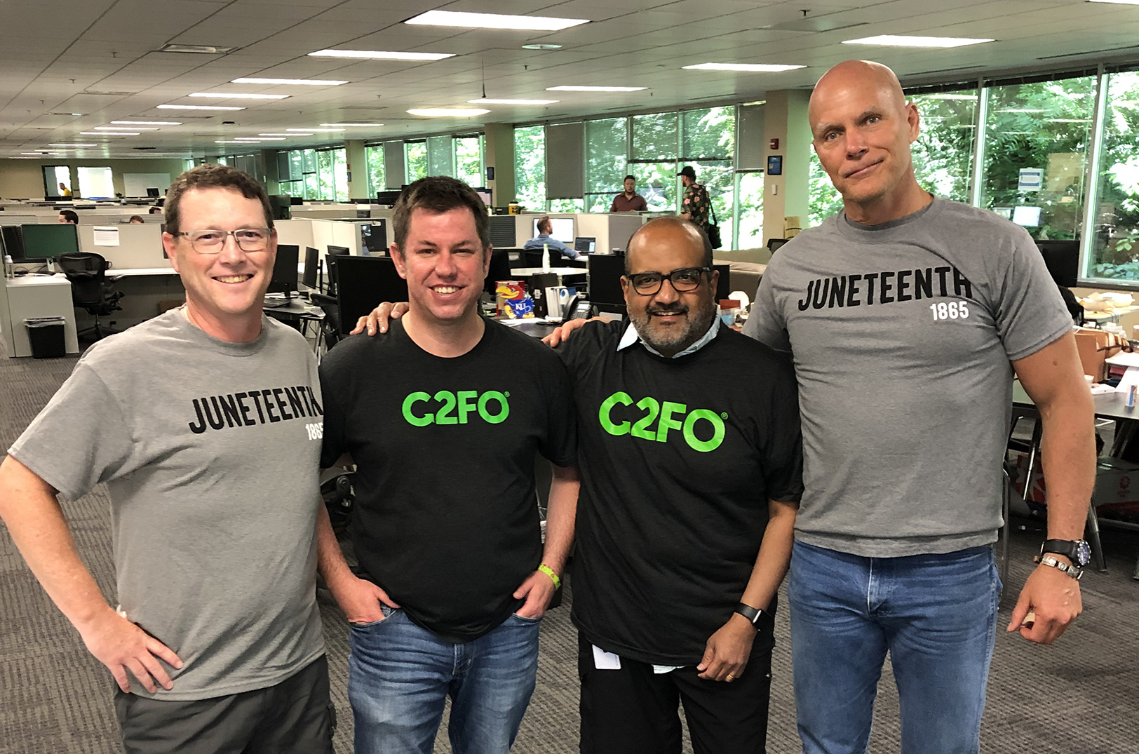 Jim Thompson, C2FO supplier relationship manager; Andy Kemp, C2FO director of training and development; Sanjay Gupta, C2FO president and COO; and Sandy Kemper, C2FO chairman and CEO; photo courtesy of Determination, Incorporated