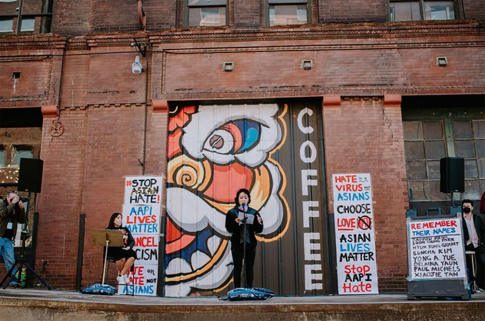 Jackie Nguyen speaks during a “Stop Asian Hate” vigil in March outside Firebrand Collective in the West Bottoms; Photo by Travis Young