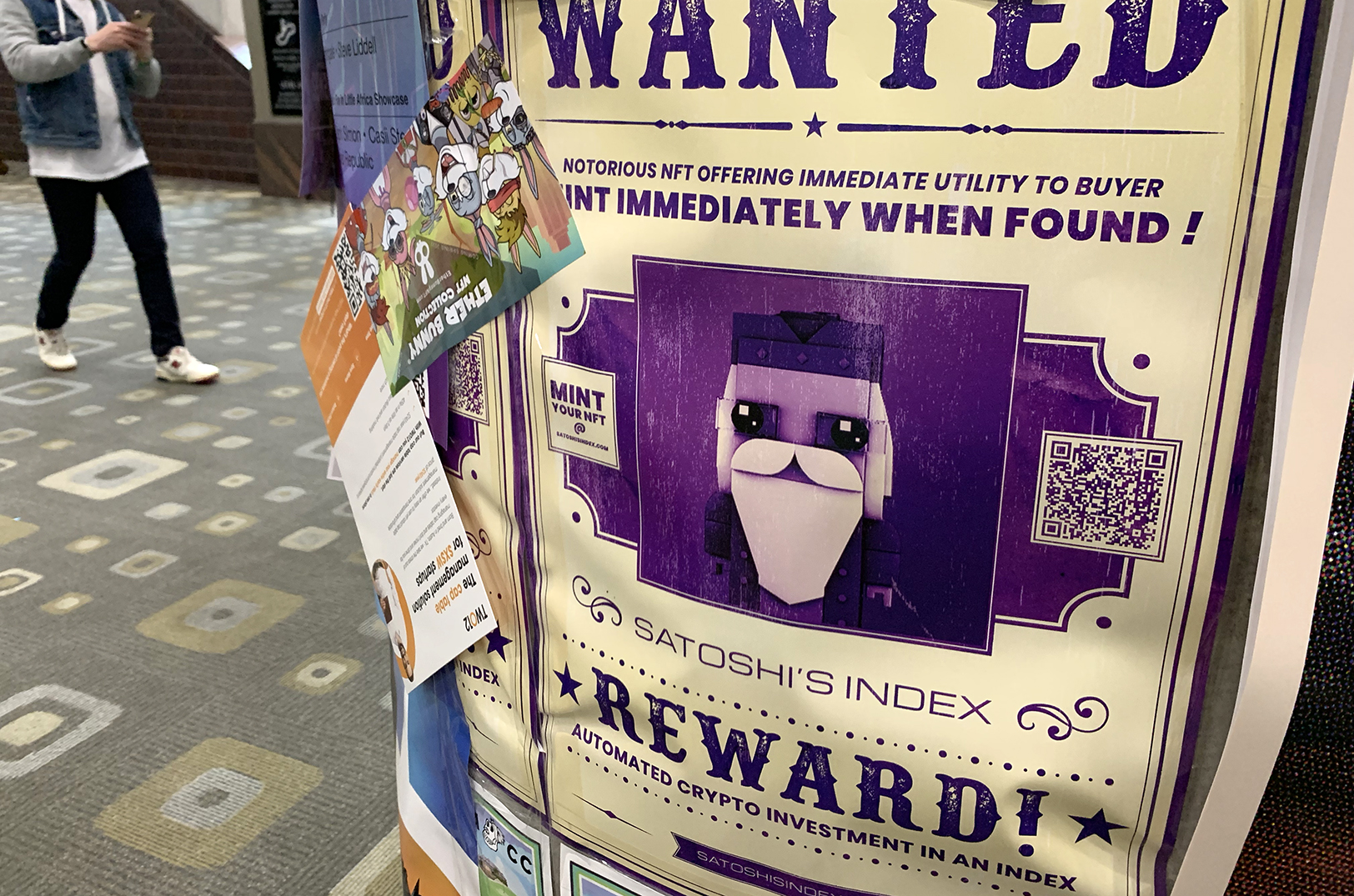 NFT promotions stuck to surfaces throughout the SXSW conference