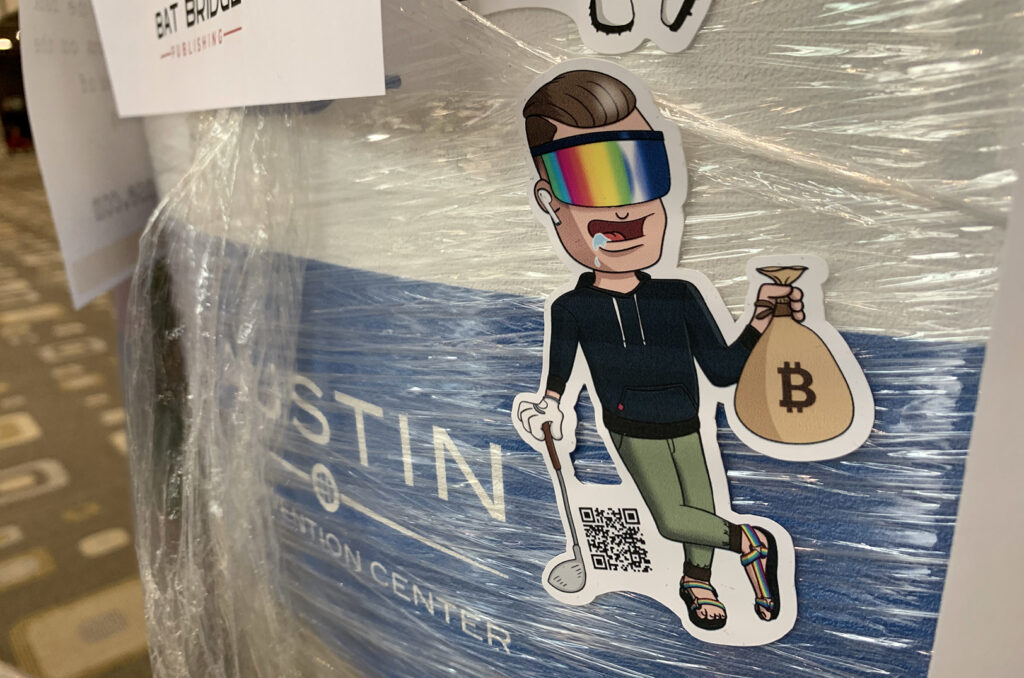 NFT promotions stuck to surfaces throughout the SXSW conference