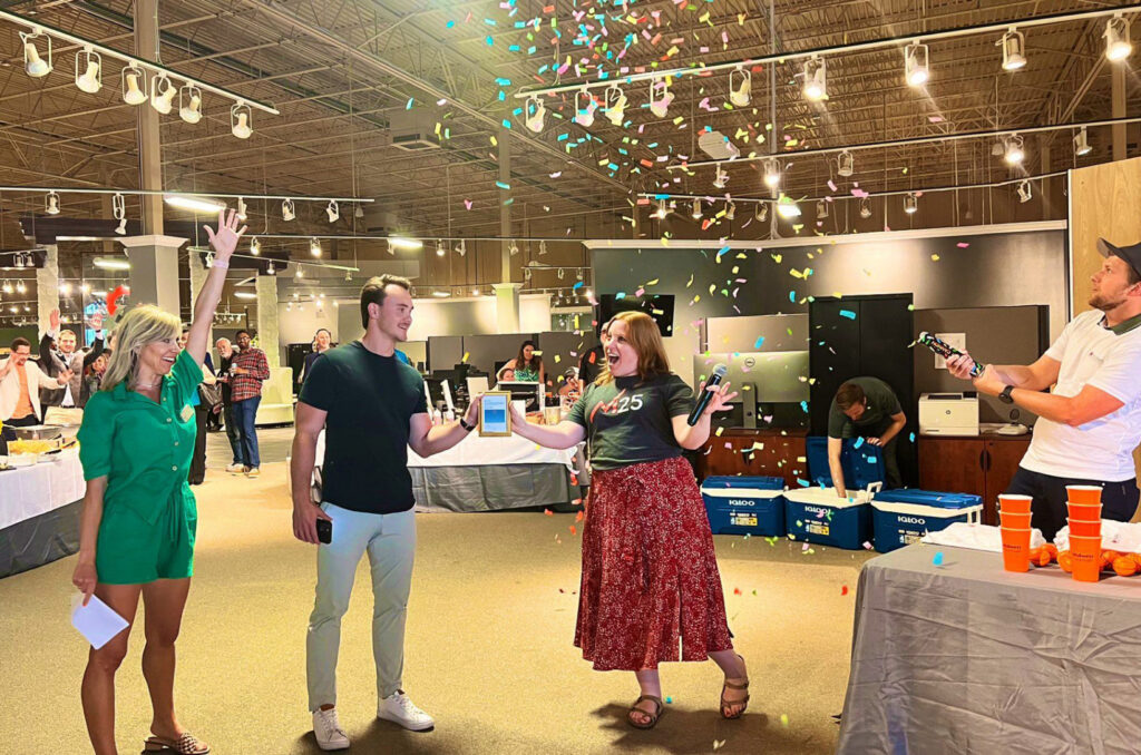 Meg Judy, EquipmentShare, and Brett Calhoun, Scale, accept the Midwest Madness win on behalf of Columbia, Missouri, from Katie Birge and Victor Gutwein, M25; photo courtesy of EquipmentShare