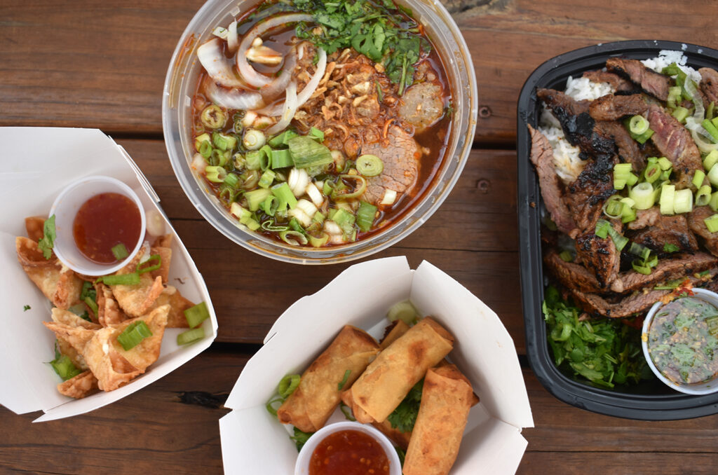 Four of Thaiger's five menu items: crab rangoon, lao spicy pho, egg rolls, and ribeye steak bowl