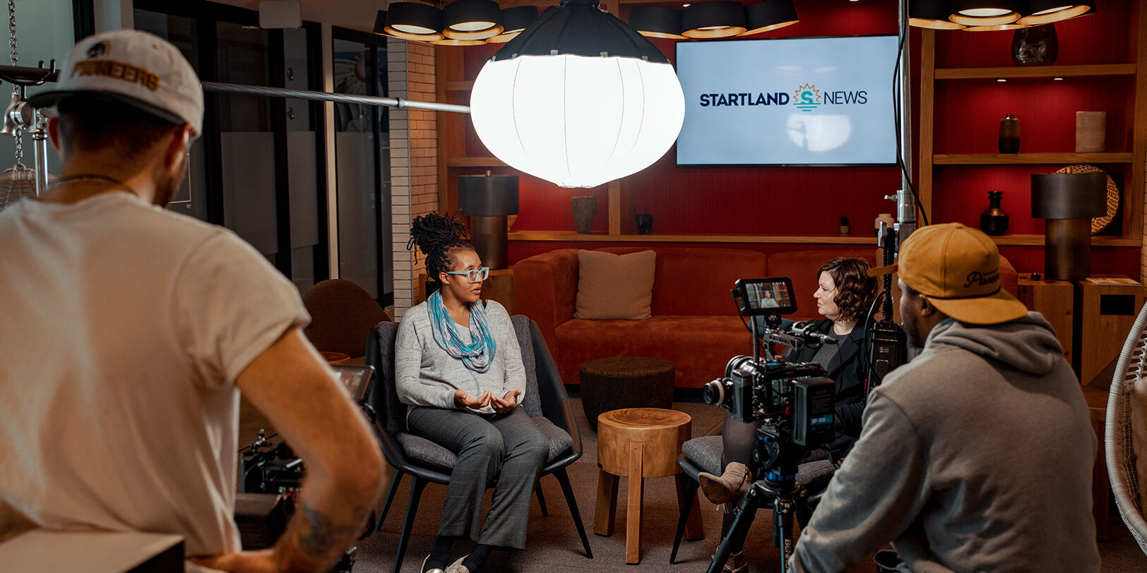 Behind the scenes of Startland News’ Kansas City Startups to Watch in 2023 video shoot: Dr. Brandy Archie, AskSAMIE, and Nikki Overfelt Chifalu, Startland News reporter; photo courtesy of Social Apex Media